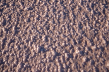 The texture of the salt lake pink.
Pink salt lake and lump salt