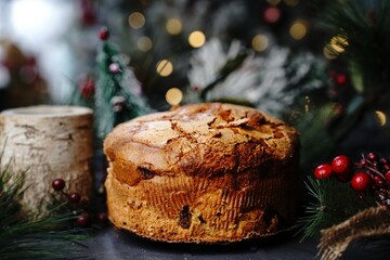 Christmas Panettone fruit bread on festive holiday background, selective focus