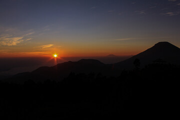 Beautiful Sunrise in Thin Orange Color Over the Mountain