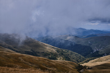 Mountain landscape.
Beautiful sunny day in the mountains.
Low clouds in mountains
Carpathian mountains in Romania