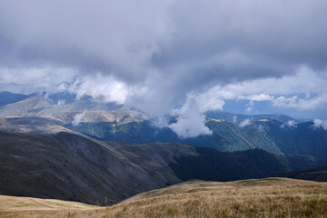 Mountain landscape.
Beautiful sunny day in the mountains.
Low clouds in mountains
Carpathian mountains in Romania
