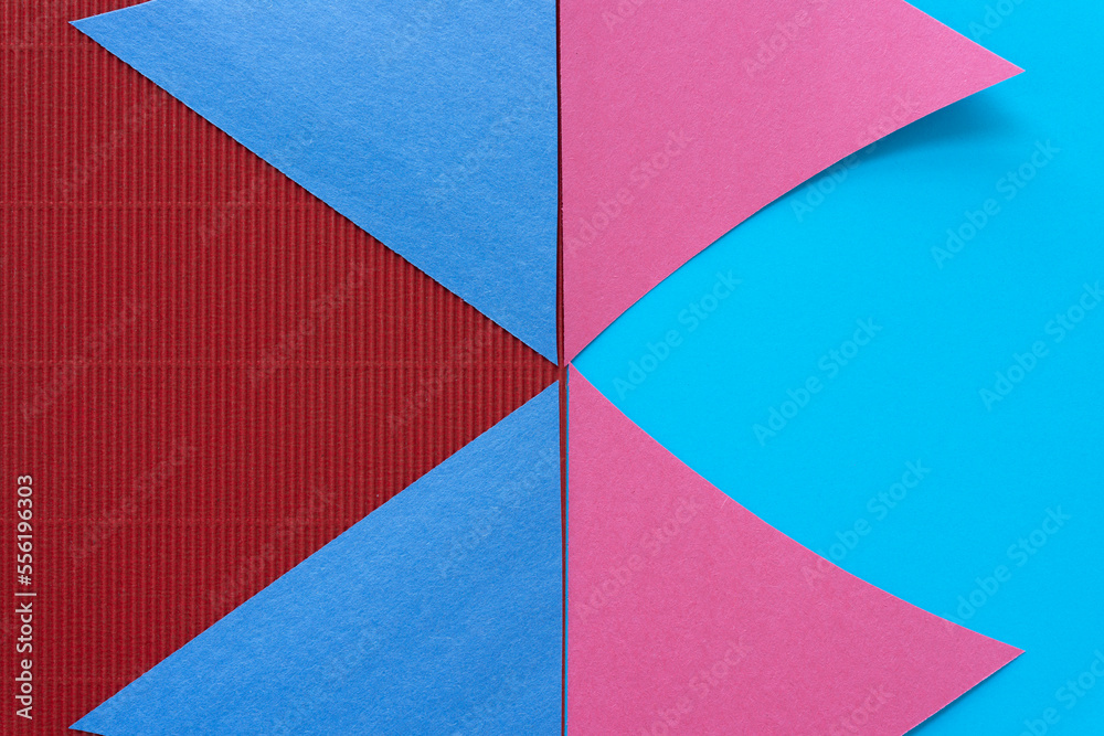 Wall mural triangle paper shapes on smooth blue and red corrugated paper