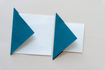 folded paper tiles on blank paper