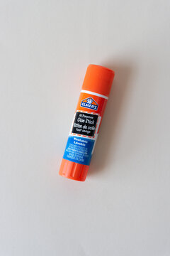 all purpose glue stick isolated on blank paper