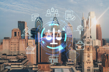 Aerial panoramic cityscape of Philadelphia financial downtown, Pennsylvania, USA. City Hall Clock Tower, sunrise. Hologram of legal icons. The concept of law, order, regulations and digital justice.