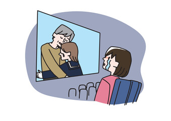 映画で感動して涙を流している女性