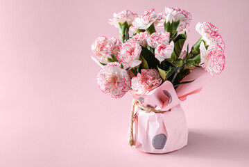 bouquet of flowers on a pink background