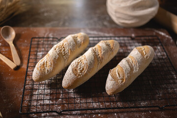 Top view of various kinds of baguette and bagel on Wooden table