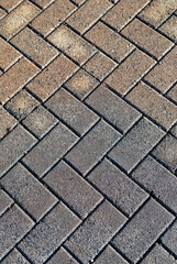 Crisscrossed Stone Textured Tiles in Gray and Tan.