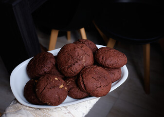 Chocolate cookies with peanut butter on a dark background
