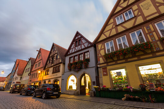 Rothenburg ob der Tauber, Germany - September 15, 2017: A warm summer evening with old historic buildings in German town of Rothenburg ob der Tauber. Bavaria. Germany.