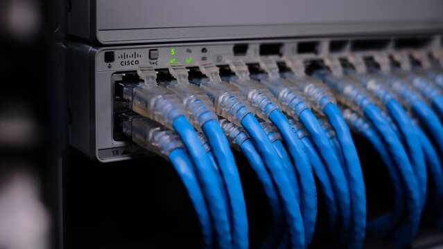 Cisco 9200L- 48 , Gigabit Switch for business and Datacenter with UTP cat6 network cable. Close up. JULY 10 2021