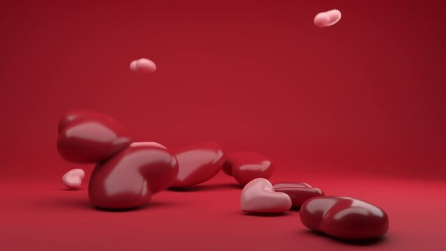 Bouncy hearts shape slow falling. Soft body physics 3d render. Cheerful animation of elastic shapes bounce.