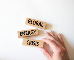 Global Energy Crisis symbol. Wooden blocks with words Global Energy Crisis. Beautiful white background. Businessman hand. Business and Global Energy Crisis concept. Copy space.