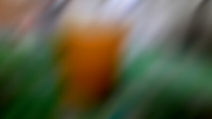 Abstract blurred background with a composition of white, green, and brown.