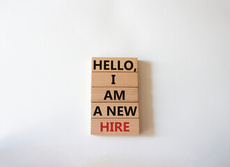 Hello I am a new hire symbol. Concept words Hello I am a new hire on wooden blocks. Beautiful white background. Business and Hello I am a new hire concept. Copy space.