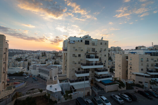 modiin ilit - israel. 22-12-2022. A view from above of buildings inside a residential neighborhood in Kiryat Safar. Israel. Sunset background