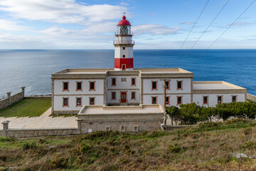Fototapeta na wymiar Baiona, Spain - December 05, 2022: maritime lighthouse in the atlantic ocean called faro silleiro, tourist place, in the town of Baiona, Spain