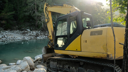 crawler excavator at earthworks in a stone quarry