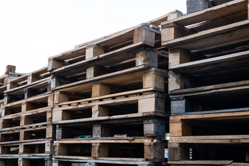 The wooden pallets stacked on top of each other