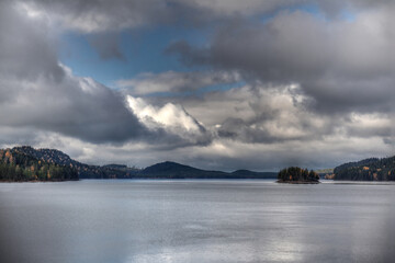 Fototapeta na wymiar Dramatic clouds over Swedish lake in Lapland