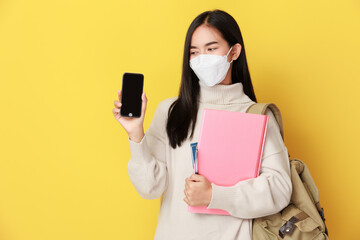 Asian woman with smart phone ,Corona virus pandemic, covid-19 education, and back to school concept