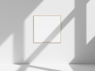 Empty frame on the white wall with window shadow