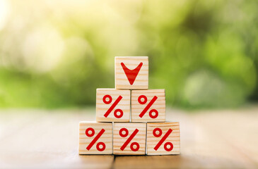 Interest rate financial and mortgage rates concept. Wooden cube block with interest rate and down...