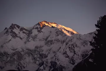 Papier Peint photo Nanga Parbat Summit of Nanga Parbat mountain lit with the sun in the morning, Pakistan