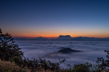 Majestic view of Doi Luang Chiang Dao in northern Thailand, the third highest mountain in Thailand, seen with beautiful dramatic clouds and colorful sky