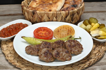 grilled meatballs with grilled onion, tomato and green pepper