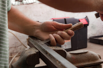 Man assembling furniture and fixing it - hobby garage concept.