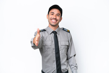 Young safeguard man over isolated white background shaking hands for closing a good deal
