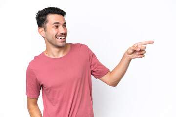 Young handsome man over isolated white background pointing finger to the side and presenting a product