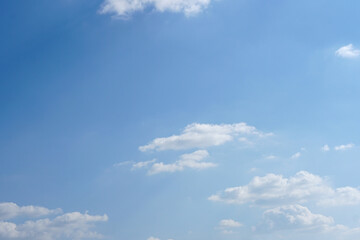 Blue sky with fluffy white clouds constantly changing shape.