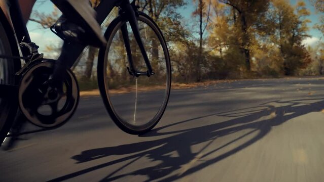 Cyclist on bicycle drivetrain system chain