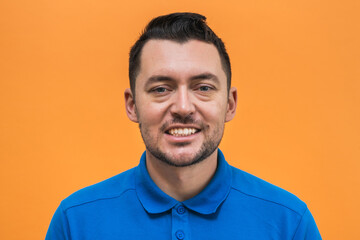 Portrait of the man on orange background. Man's emotions