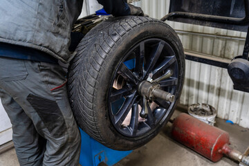 Close up of changing car tyre. Car tire fitting