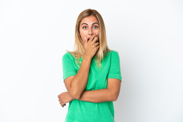 Blonde Uruguayan girl isolated on white background surprised and shocked while looking right