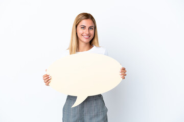 Blonde Uruguayan girl isolated on white background holding an empty speech bubble