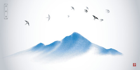 Swallows flying over the blue mountain. Traditional oriental ink painting sumi-e, u-sin, go-hua. Hieroglyph - happiness.