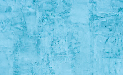 Abstract background of turquoise plaster on the wall.