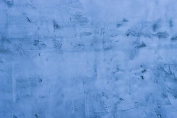 Surface of blue fresh plaster on a concrete wall.