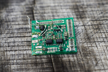 Circuit board macro shot reveals small electrical trace and SMD capacitor