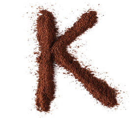 Ground coffee in shape letter , K isolated on white, clipping path