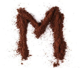 Ground coffee in shape letter M isolated on white, clipping path