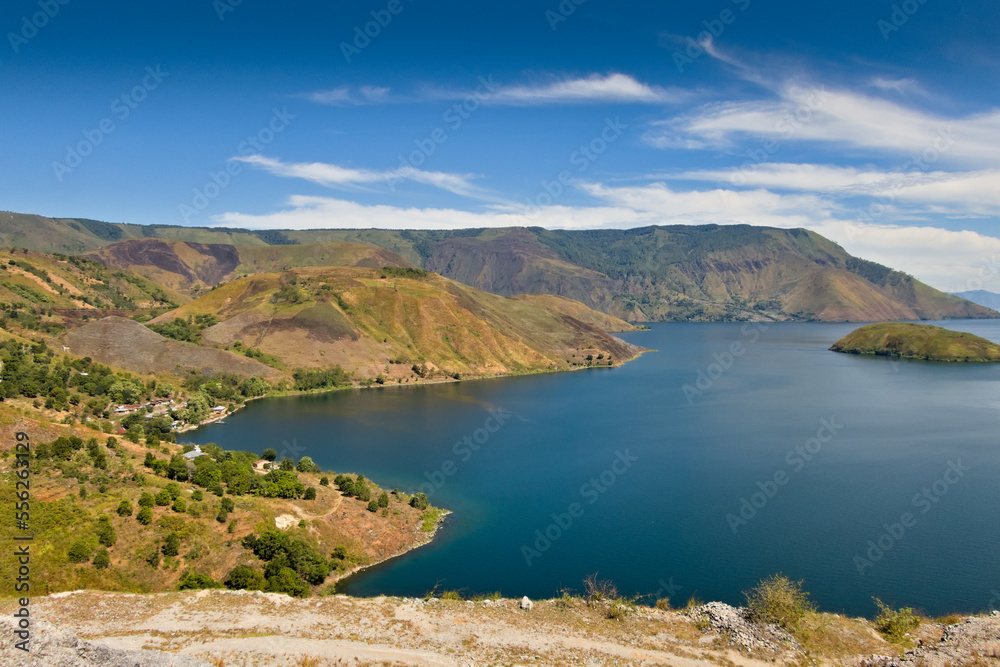 Wall mural west coast of lake toba with mountains in the background, north sumatra, indonesia