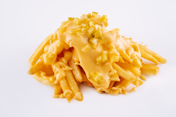 Pouring cheese sauce on french fries on white background