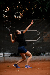 Fototapeta na wymiar great view of active sporty woman tennis player with tennis racket in hand doing pitch