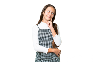 Young girl over isolated chroma key background thinking an idea while looking up